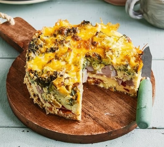 Image of a round Instant Pot Frittata on a wooden board